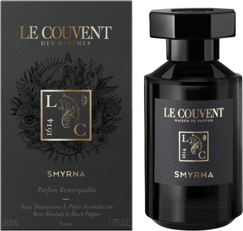 Een zwarte parfumfles met bijpassend doosje, gelabeld "Le Couvent des Minimes Smyrna" met bloemen- en oogillustraties.