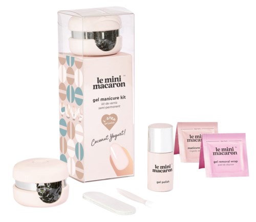 Nail polish kit with remover wraps, gel polish bottle, small containers, and a nail file. Packaging is pink and white.