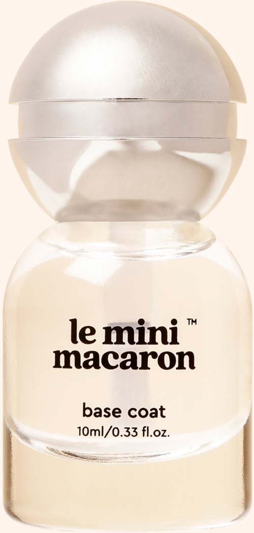 A small, clear bottle of Le Mini Macaron base coat nail polish with a rounded silver cap.
