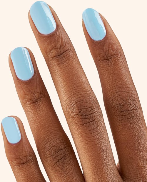 Four fingers with light blue painted nails on a hand with dark skin. The nails are well-manicured and shiny.