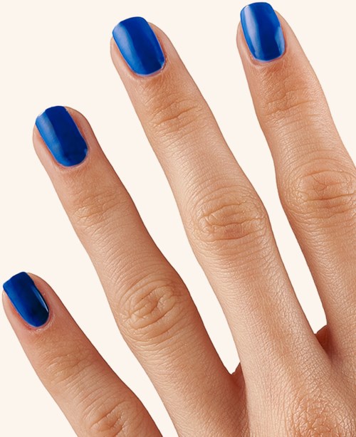 Hand with nails painted blue. Close-up of fingers and shiny nail polish. Simple and neat appearance.
