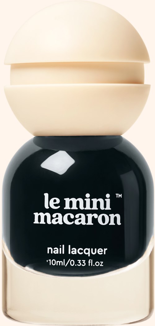 A small black bottle with a beige cap, labeled 'le mini macaron nail lacquer'.