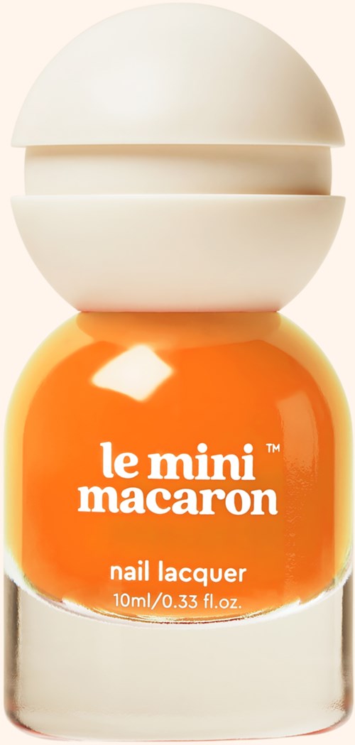 Orange nail lacquer bottle with white cap, labeled 'le mini macaron' and 'nail lacquer.'