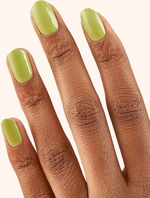 Hand with green painted nails showing four fingers, close-up image. Clear and bright appearance.