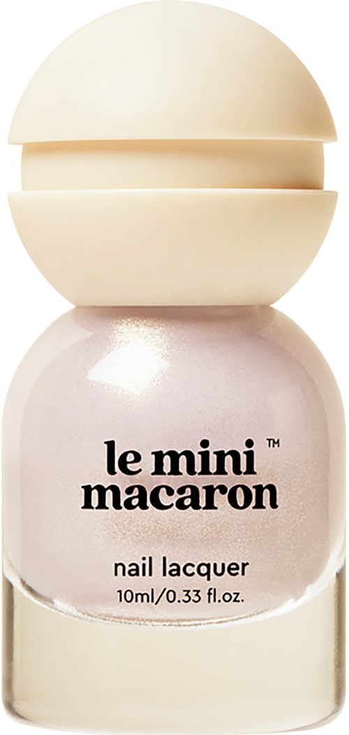 A small bottle of nail polish labeled 'le mini macarons' with a rounded cap and pinkish color.