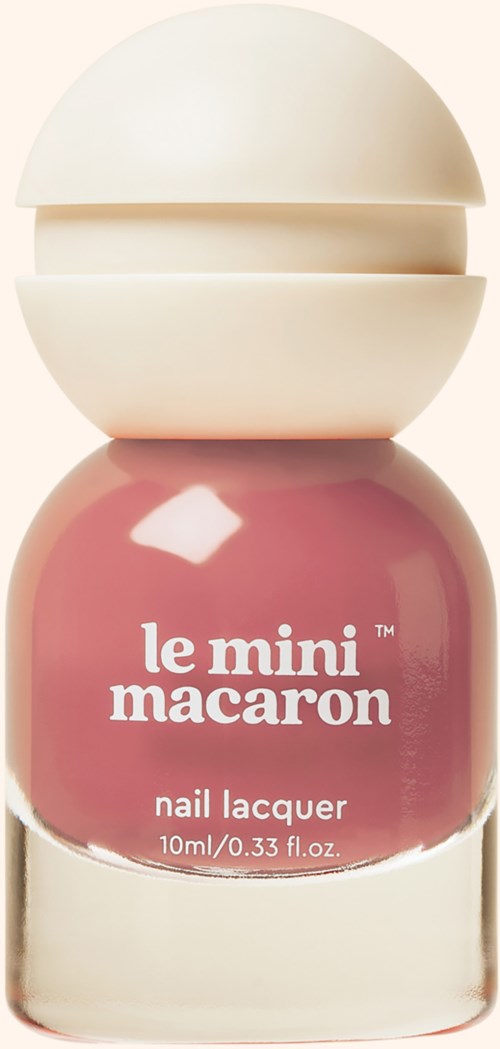 A pink nail polish bottle with a white cap, labeled 'le mini macaron' and 'nail lacquer'.