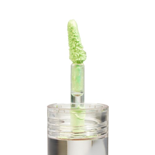 A clear nail polish bottle with a green fluffy brush attached to the top.