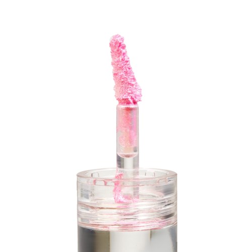 A clear nail polish bottle with pink polish on the brush. The brush is raised above the bottle. There is no background.