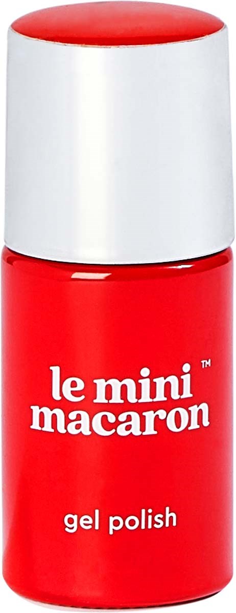 A small red bottle of gel nail polish with a white cap. The label says "le mini macaron" and "gel polish."