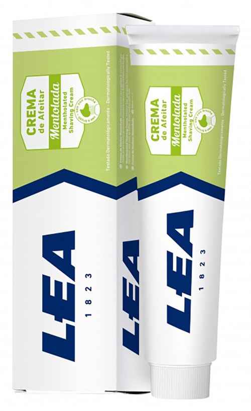 Eine Tube Creme und ihre Verpackung mit grünen, weißen und blauen Farben, beschriftet auf Spanisch und nennt natürliche Inhaltsstoffe.
