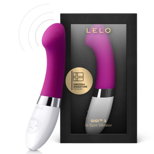 A purple G-Spot vibrator with a white base, shown in a box with gold and black details, branded LELO.