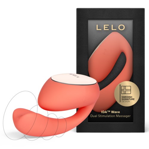 Ein pfirsichfarbener Dual-Stimulations-Massager, geformt wie ein gebogenes 'S', mit schwarzem Griff und Verpackung.