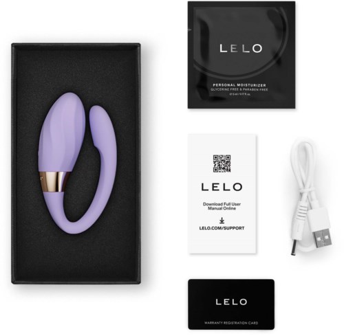 Purple vibrator with gold accent in a black box, includes charger, user guide, and warranty card.
