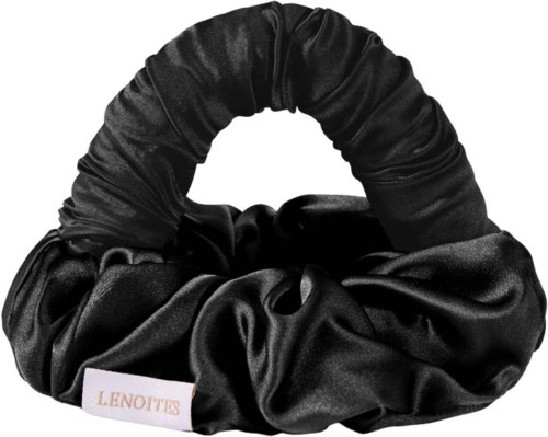 A black satin hair scrunchie with a white label that says 'LENOITS'.