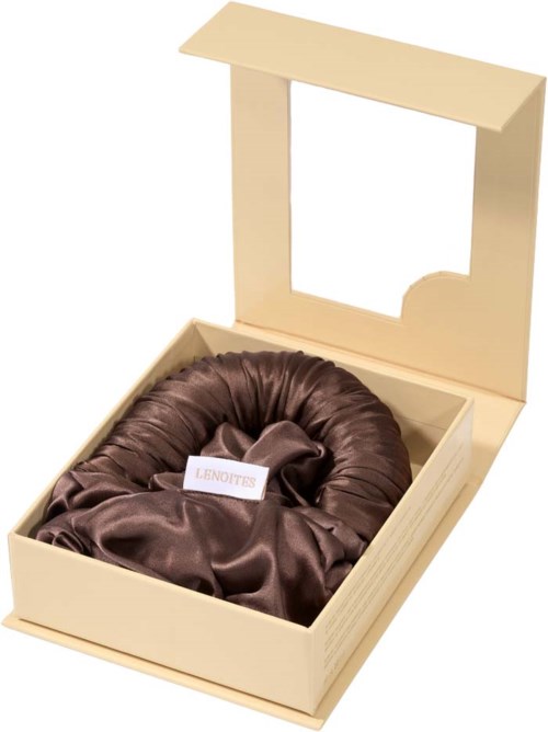 A box with a lid, contains a brown satin fabric item, likely a gift or clothing accessory.