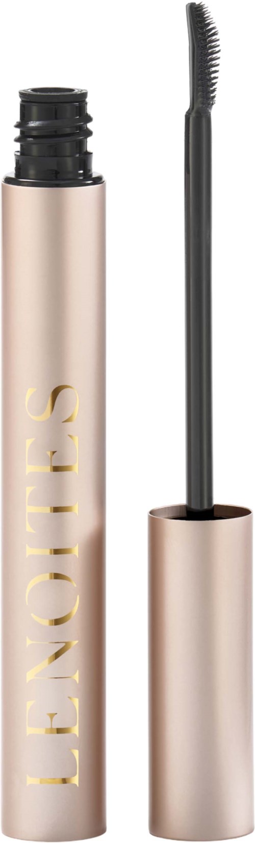 En beige mascara-ram med guldtext och en svart mascaraborste med böjd borste.