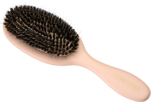 A soft pink hairbrush with black bristles and the brand name 'LEAOUITES' on the handle.