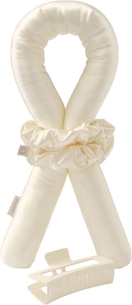 Cream-colored baby nest with a rope, blanket, and a clip for car seats in a vertical layout.