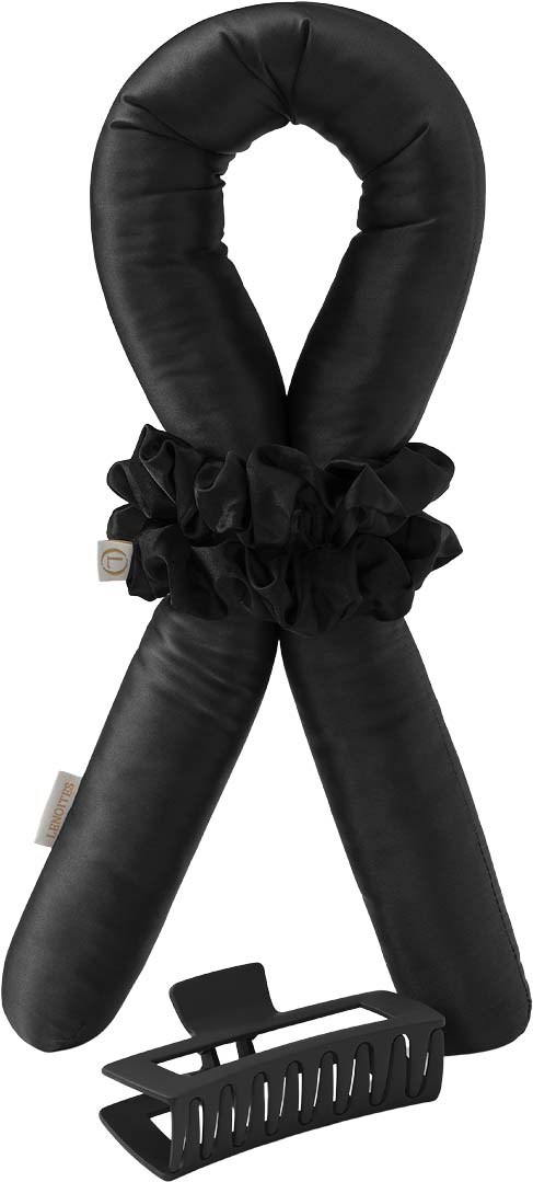 A black neck pillow with a ruffle in the middle and a black clip at the bottom.