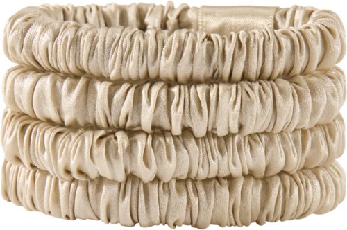 Three beige fabric hair ties or scrunchies stacked together. They are soft, stretchy, and gathered. Perfect for hair.