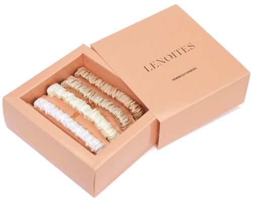 A pink box with four rows of cream-colored hair scrunchies inside. The box says 'SCRUNCHIES' on the lid.