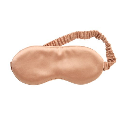 Eine beige Schlafmaske mit elastischem Band zum Abdecken der Augen beim Ruhen oder Schlafen.