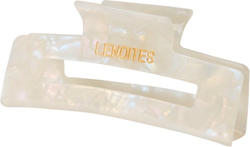 Een parelgekleurde haarclip met het woord "LENOITES" in goud. De clip heeft een eenvoudige, gebogen vorm.
