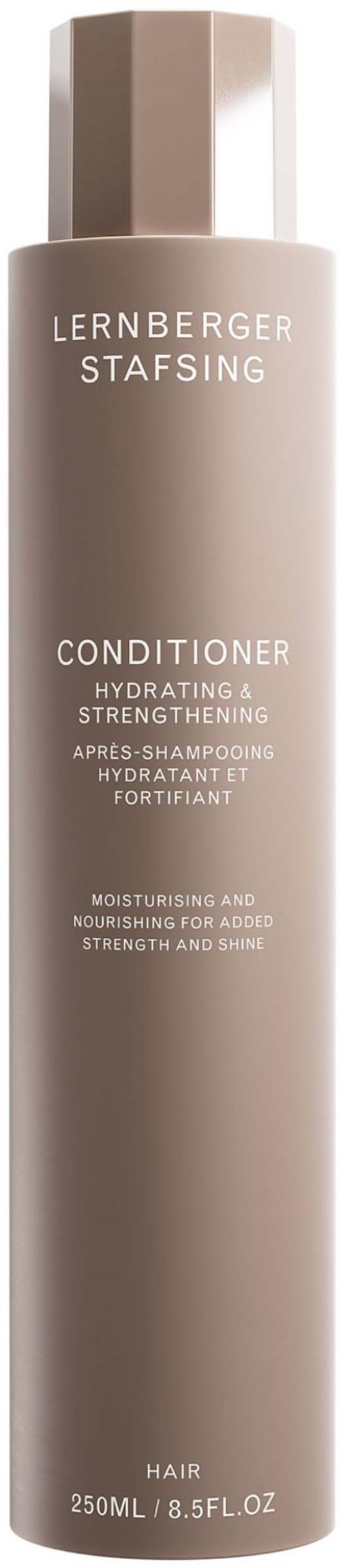 Eine lange, beige Flasche mit LERNBERGER STAFSING Conditioner mit weißem Text für Haarbefeuchtung und -stärkung.