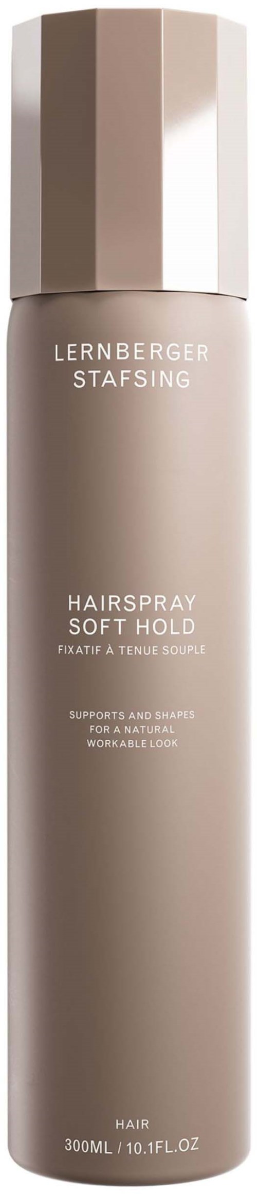 Ein langer, beiger Sprühflasche mit sechseckigem Deckel, gekennzeichnet als 'Lernberger Stafsing Hairspray Soft Hold.'