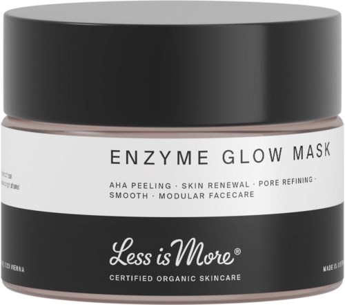 En svart og hvit krukke merket 'Less is More' med 'Enzyme Glow Mask' for hudpleie og fornyelse.