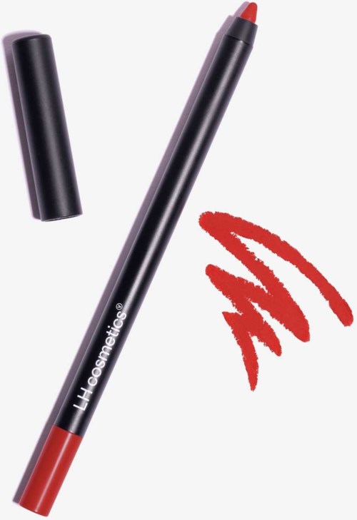 A black lip liner pencil with a red tip, and a red lipstick mark near it.