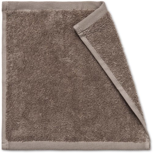 A brown, soft-looking towel with a folded corner, showing the textured fabric.