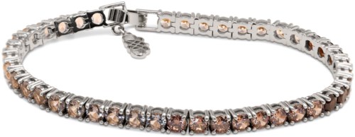 A silver and rose gold bracelet with sparkling stones evenly spaced around the band.