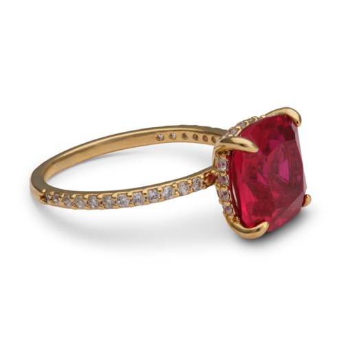 Gold ring with a large, rectangular red gemstone and small diamonds along the band.