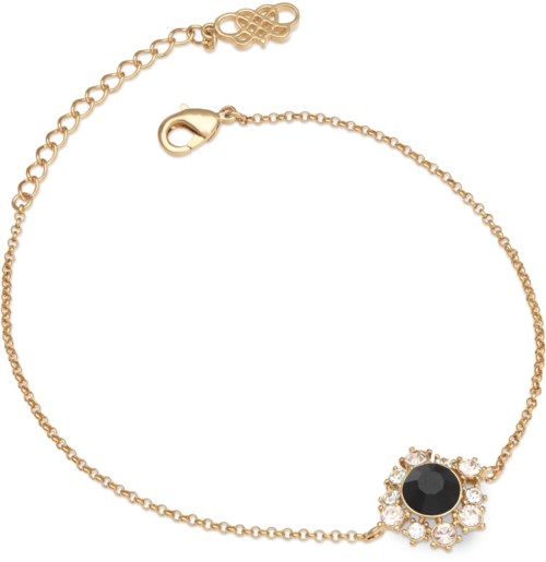 A gold bracelet with a black gemstone in the center and small clear stones around it.