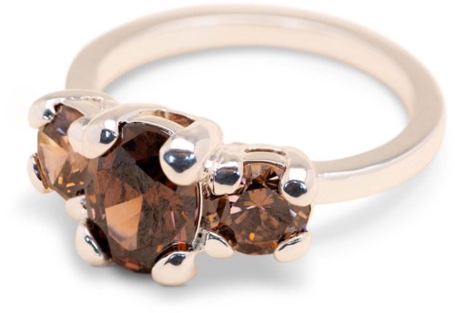Silver ring with three brown gemstones set in a row.