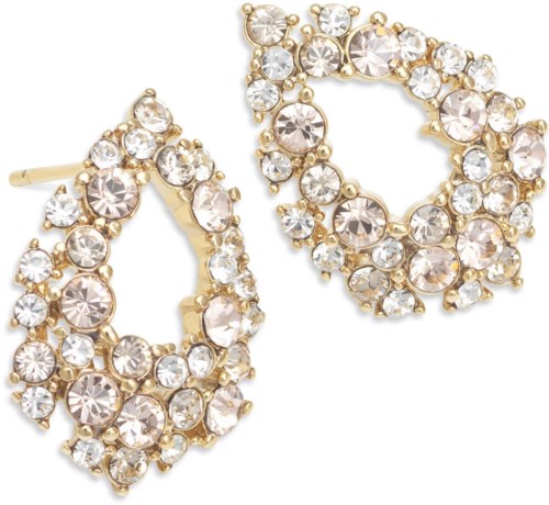 Gold earrings with many clear, sparkling stones in a circular design.