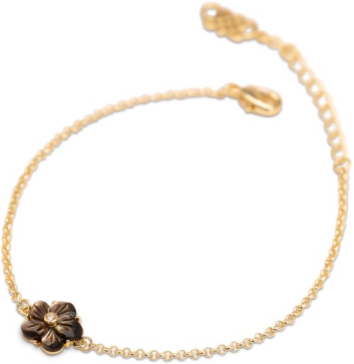Gold chain bracelet with a black flower charm and small bead details.