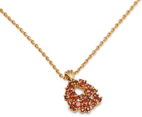 A gold chain necklace with a pendant decorated with pink and orange gemstones in a floral shape.