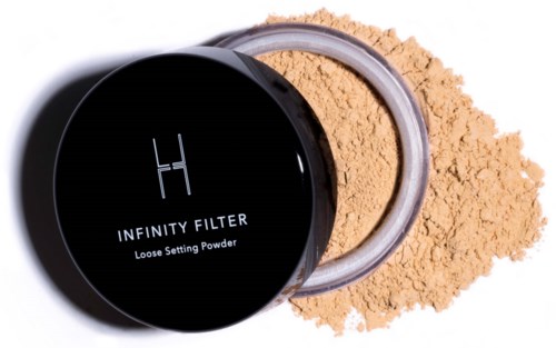 Container met losse poeder, met wat uitgelopen, gelabeld "Infinity Filter."
