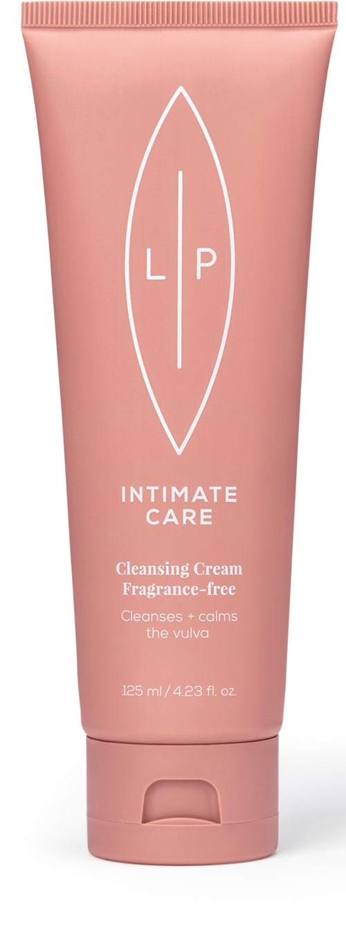 Hellrosa Tube mit der Aufschrift 'Intimate Care Cleansing Cream Fragrance-Free' und einem einfachen Blattdesign und Text über beruhigend und reinigend.