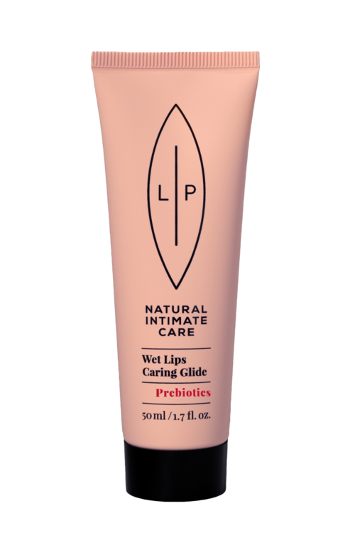 Rosafarbene Tube mit Lippenbalsam, beschriftet 'Natural Intimate Care, Wet Lips Caring Glide, Prebiotics, 50ml.'
