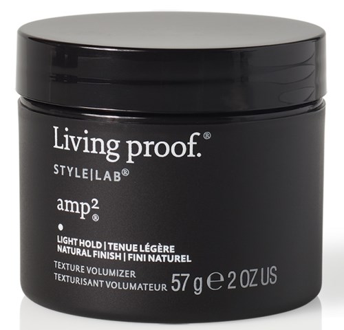 A black container with a silver lid, labeled 'Living proof' and 'amp2' hair product, 57 grams inside.