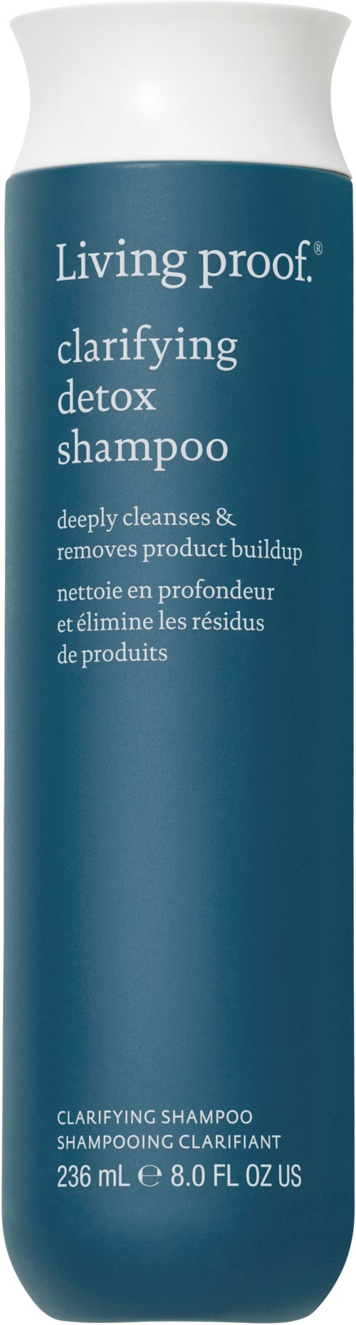 A tall blue bottle of Living proof clarifying detox shampoo with white cap and text description.
