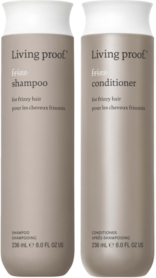 Two beige bottles labeled 'Living proof' for shampoo and conditioner for frizzy hair.