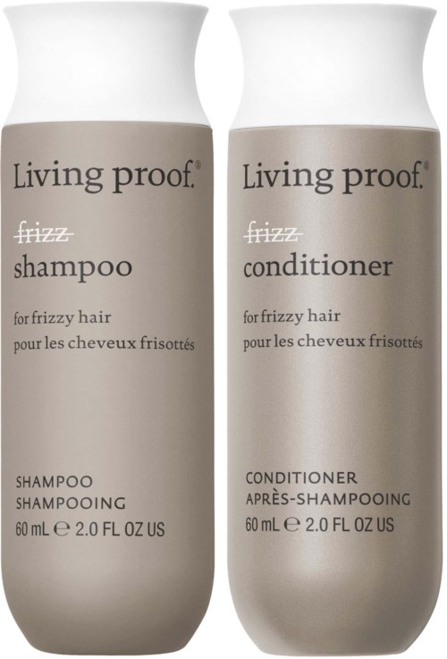Two bottles of Living Proof hair products for frizzy hair, one shampoo and one conditioner. Simple white and beige bottles.