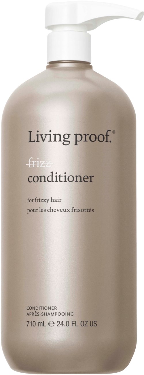 A tall, beige bottle with a pump labeled 'Living proof' and 'frizz conditioner' for hair.