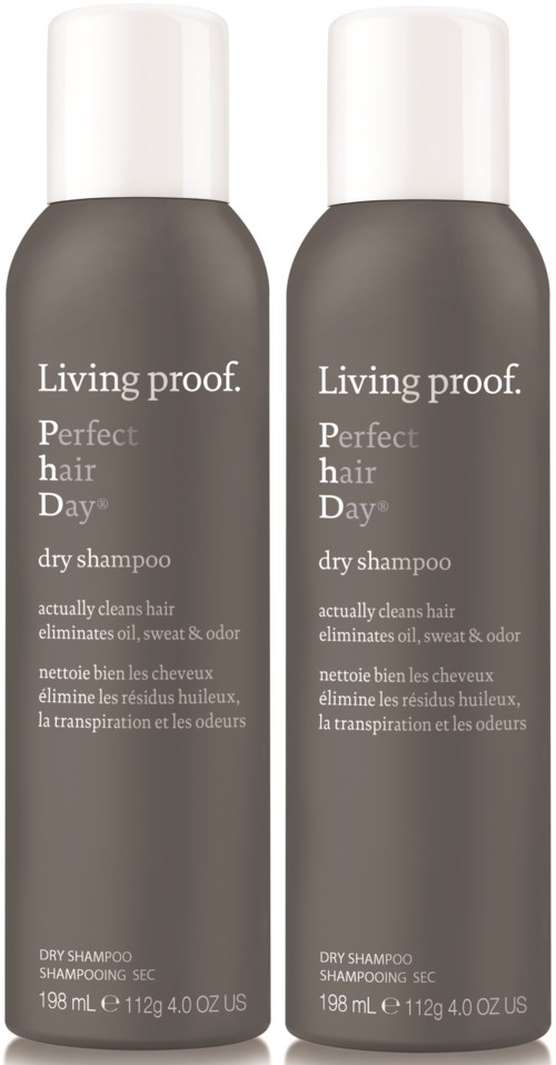 Two bottles of Living proof. Perfect hair Day dry shampoo with white caps, gray bottles, and product details written.