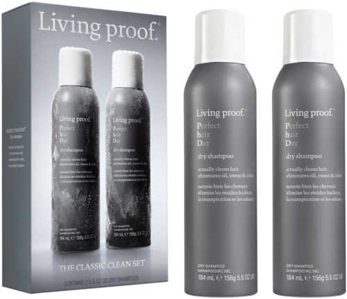 A box with two bottles of Living proof dry shampoo, gray bottles with white caps, and product description.
