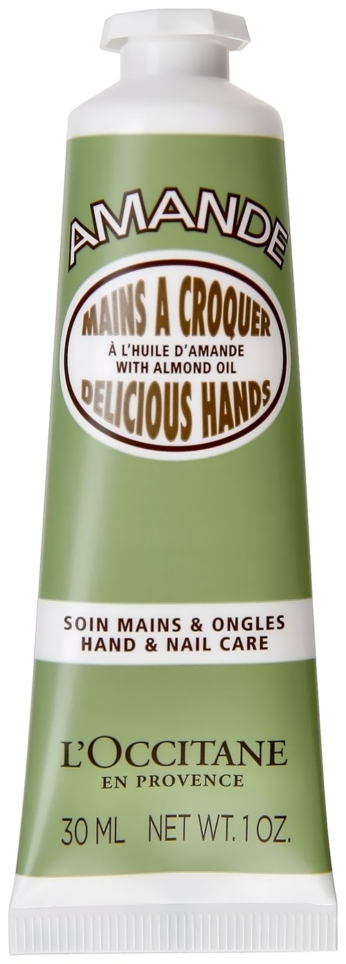 En grön tub med hand- och nagelvårdsrengöring med mandelolja, märkt på flera språk, 30 ml storlek.